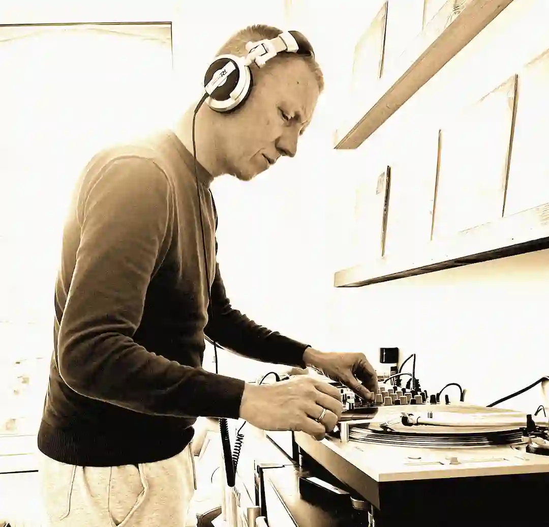 Close-up portrait of DJ SEK, an electronic music artist from The Hague, featured on the Outer Signals Spacechord podcast.